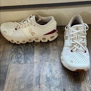 On Running Cream and Maroon Athletic Shoes